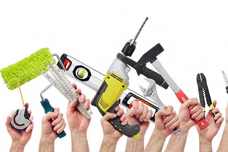 hands with various tools